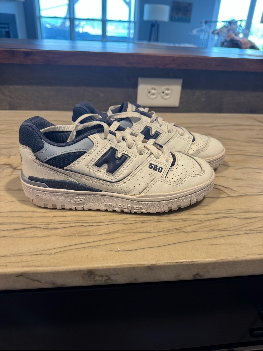 New Balance women’s White and Navy 550 Sneakers